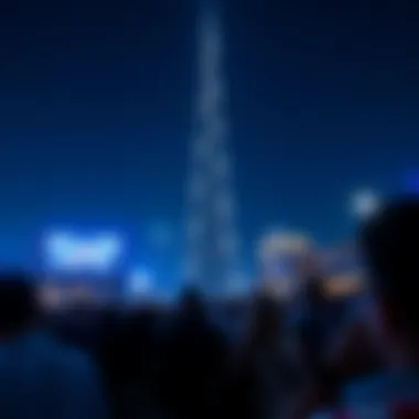 Crowds gathered to enjoy the Burj Khalifa light show against the night sky