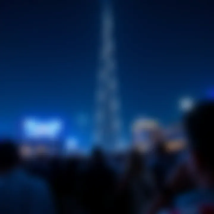 Crowds gathered to enjoy the Burj Khalifa light show against the night sky