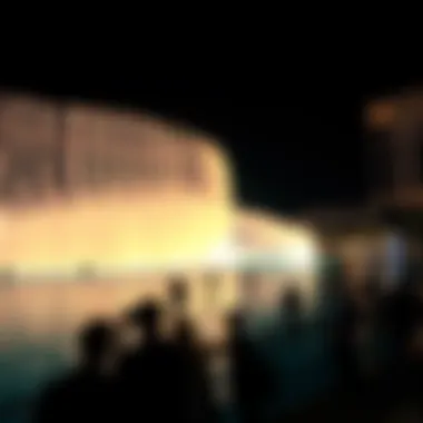 Visitors marveling at the synchronized water and light display of the Dubai Fountain.