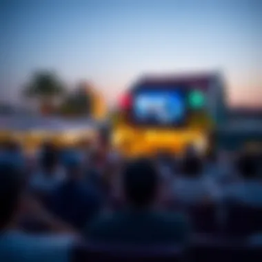 Audience enjoying a film screening in a vibrant outdoor venue