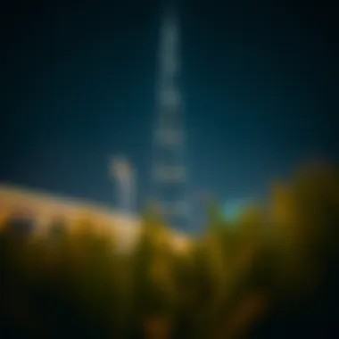 Night view of the Financial Tower illuminated, symbolizing Dubai's economic vibrancy