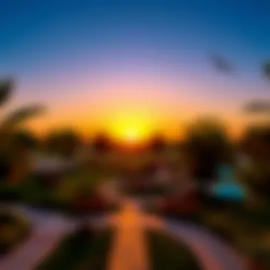 Stunning sunset over a well-designed urban park highlighting paths and seating areas.